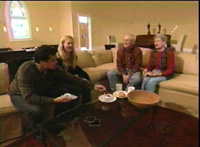 Photo of new living room with four people chatting
