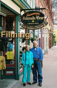Verna and Rich Salmon in front of main street stores, Georgetown before filming Silver Plume